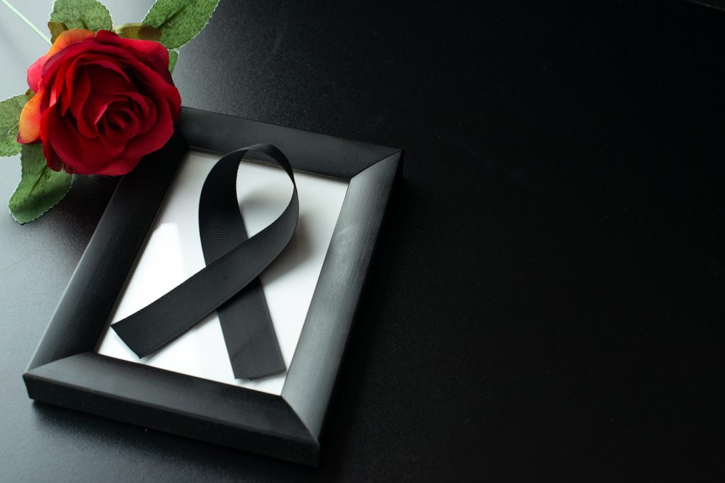 top view picture frame with black bow dark wall scaled 1